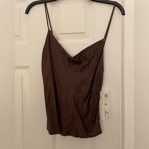 Adorable top with a buttons to compliment in the back